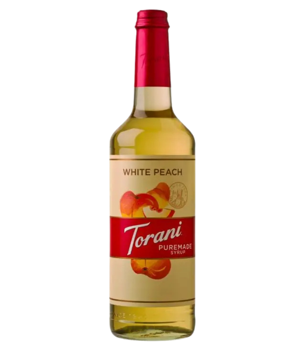 Torani Puremade White Peach syrup bottle on a white background
