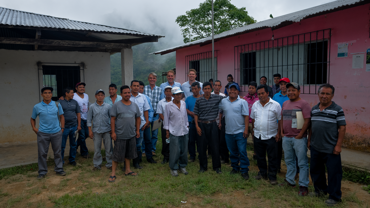Photo of the owners of Java City with the coffee farmers they partner with 