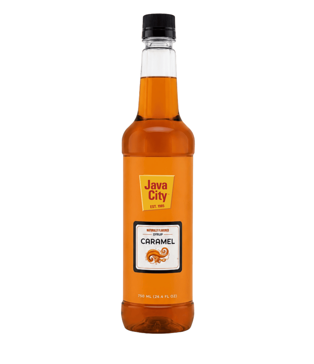 A bottle of Java City Caramel Syrup on a solid white background. The bottle is made of clear glass showing the amber-brown syrup inside, with a black screw cap and an orange label featuring the Java City logo and a caramel graphic.