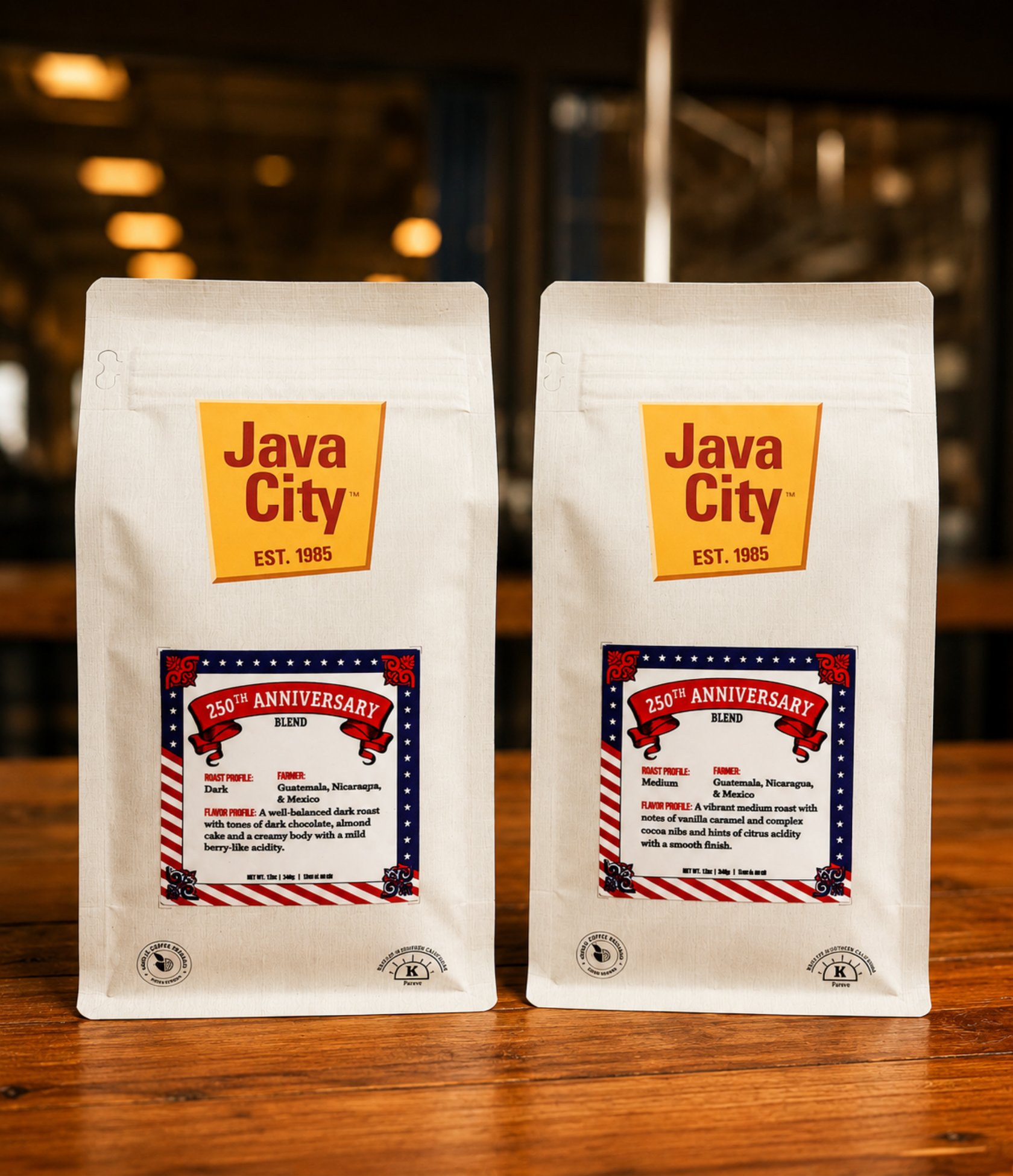 Two bags of Java City coffee on a wooden surface with a blurred background