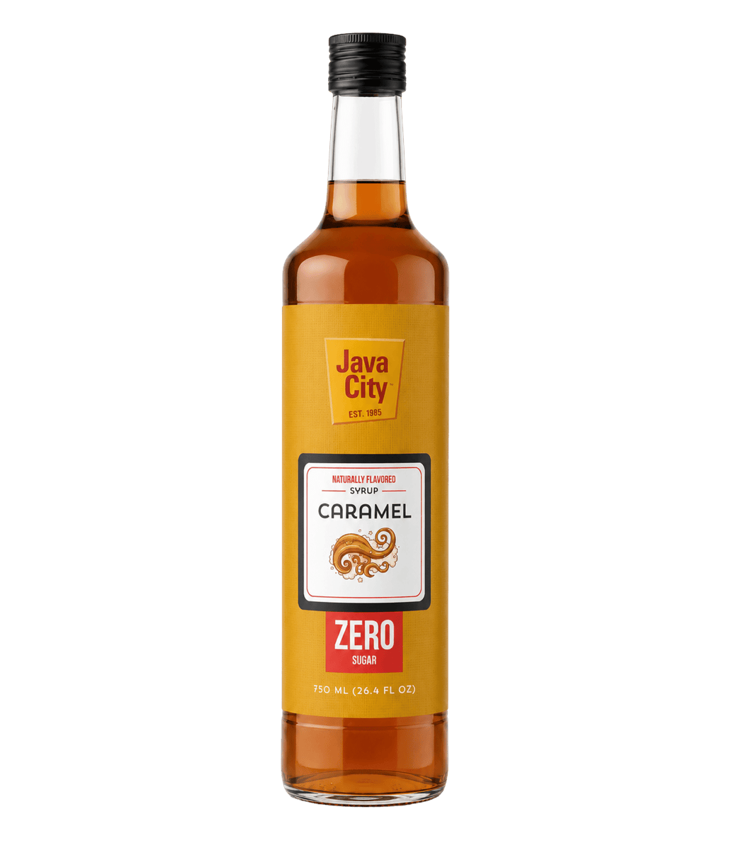 A bottle of Java City Caramel Zero Non-Alcoholic Sweetener, 750 mL, featuring a golden-yellow label with a white and red logo panel, filled with amber liquid, and sealed with a black cap, set against a plain white background.