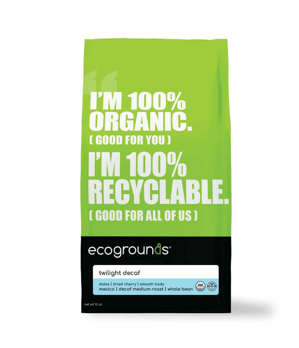 Green coffee bag  of Ecogrounds Twilight Decaf with text about organic and recyclable qualities on a transparent background