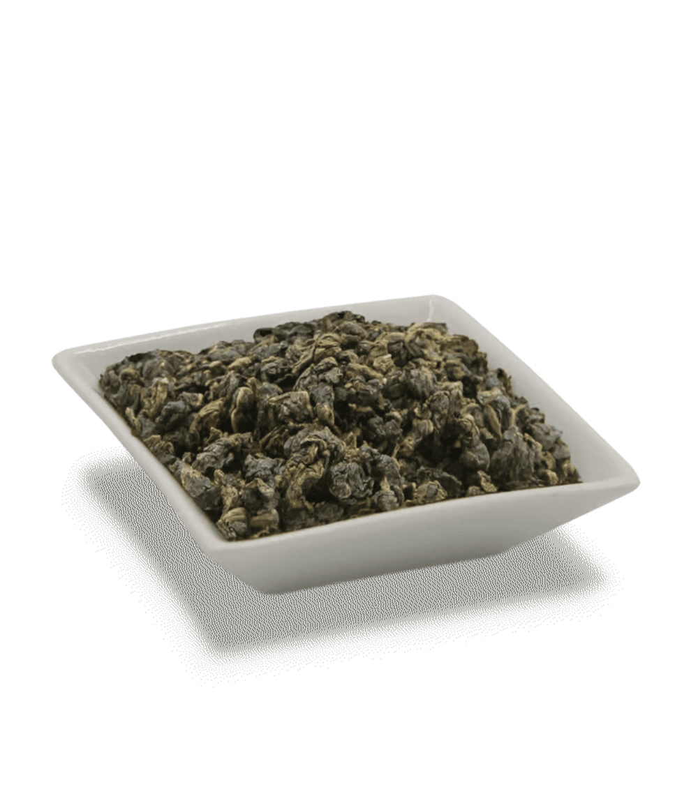 Dry green tea leaves in a white square dish on a transparent background