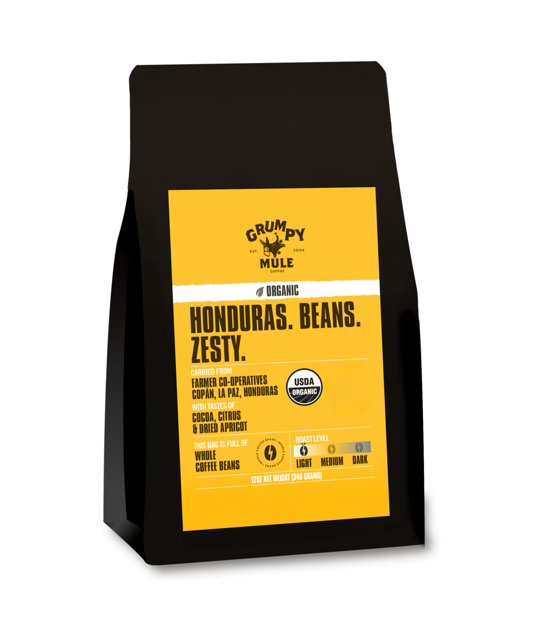 Coffee bag with yellow label featuring 'Grumpy Mule' branding on a transparent background