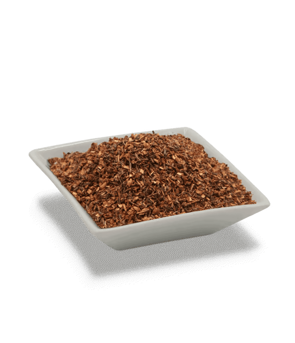 Square white dish filled with brown ground material on a transparent background