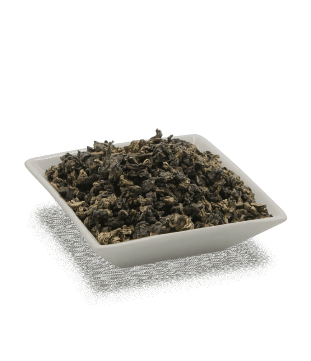 Dry tea leaves in a white square container on a transparent background