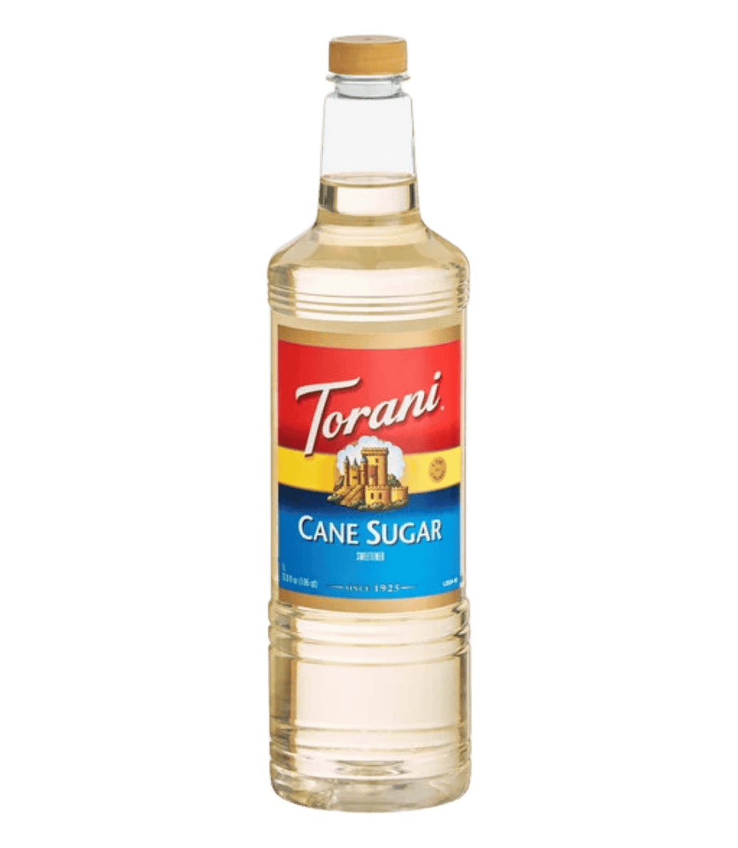 Torani cane sugar syrup bottle on a white background